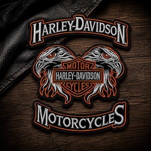 May include: Three embroidered patches featuring the Harley-Davidson logo. The top patch reads Harley-Davidson in white with orange borders. The center patch shows a shield with Motor Harley-Davidson Cycles and two eagle heads. The bottom patch reads Motorcycles.