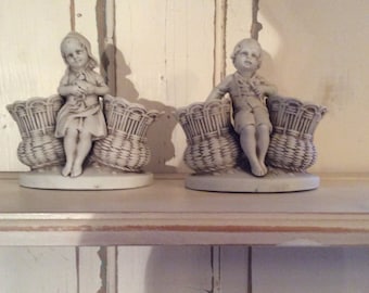 Bisque boy and girl figurine pair