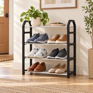 May include: A four-tier shoe rack with a black frame and white shelves. The top shelf holds a potted green plant and a small tray with keys. The lower three shelves are organized with various pairs of sneakers, loafers, and flats in neutral tones.