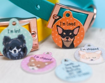 May include: A set of five colorful dog ID tags with different designs. The tags feature a chihuahua, a black and white dog, and a brown and white dog. The tags have the text "I'm loved", "I'm lost", "I'm chipped", and "Smith Family" printed on them.