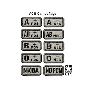 May include: A collection of ten rectangular ACU camouflage patches with black embroidered text. The patches display blood types A, AB, B, and O with positive or negative signs, plus NKDA and NO PCN labels. Each patch has a dark border.