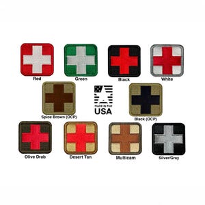 May include: A collection of ten square embroidered patches, each featuring a central cross design in various colour combinations including red, green, black, white, spice brown, olive drab, desert tan, multicam, and silver grey, with a Made in the USA logo.