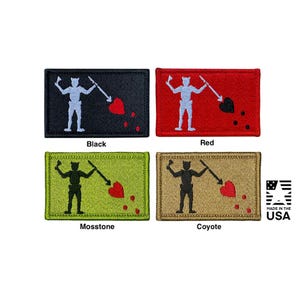 May include: Four rectangular embroidered patches featuring the Blackbeard flag design. Each patch displays a skeleton figure holding a spear pointed at a heart with three drops below. Available in black, red, moss stone, and coyote color variations.