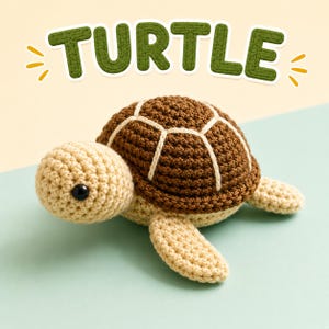 May include: A crocheted turtle toy with a beige head and limbs, a dark brown shell with white stitched detailing, and a black bead eye. Above the turtle, the word TURTLE is written in large, textured, dark green, rounded letters.