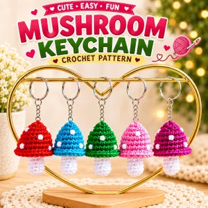 May include: Five crocheted mushroom keychains in red, blue, green, light pink, and dark pink, each with white spots and a white stem, hanging from a gold heart-shaped stand. The text reads CUTE EASY FUN MUSHROOM KEYCHAIN CROCHET PATTERN.
