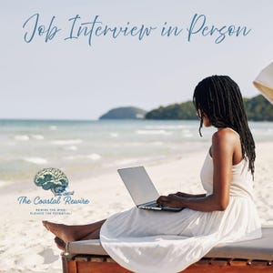 Peut inclure: Une personne aux cheveux tressés foncés portant une robe blanche est assise sur une chaise longue en bois sur une plage de sable, utilisant un ordinateur portable argenté. Le texte Job Interview in Person et le logo The Coastal Rewire sont visibles.