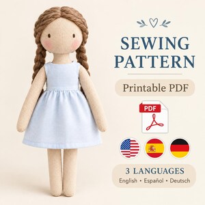 May include: A fabric doll with brown yarn hair in two braids, wearing a light blue dress. Text reads: SEWING PATTERN, Printable PDF, 3 LANGUAGES, English, Español, Deutsch. Includes a PDF icon and flags for the United States, Spain, and Germany.