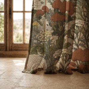 May include: A sheer curtain panel featuring a botanical print with clusters of orange, white, and yellow flowers set against a backdrop of green foliage. The fabric has a visible weave texture and hangs in soft folds, allowing light to pass through.