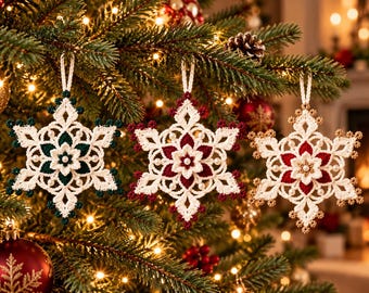May include: Three crocheted snowflake ornaments hanging from a tree. Each snowflake features a white base with a central flower design, accented by small white beads. The tips are coloured in dark green, deep red, and metallic gold respectively.