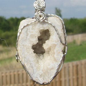 Keokuk Geode pendant wrapped in argentium silver wire