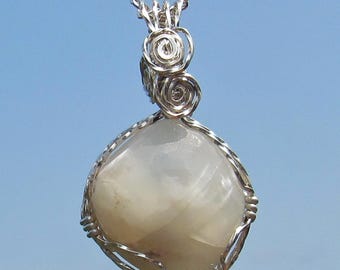 Moonstone cabochon wrapped in argentium  silver wire