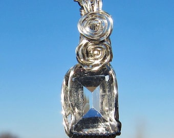 Collier en argent avec topazes facettées et taille émeraude
