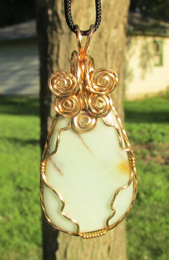 Items similar to Polished Serpentine Pendant. wire wrapped in twisted