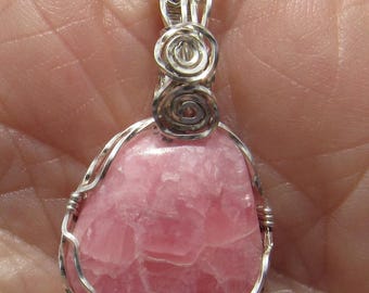 Pendentif enroulé de fil de rhodochrosite cabochon en argent sterling argntium