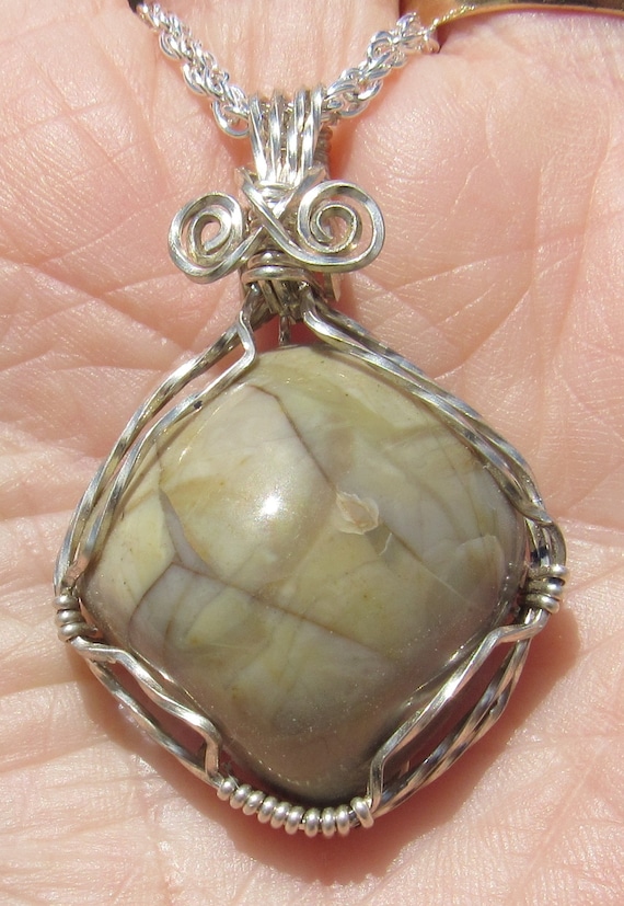 Mozarkite Cabochon wire wrapped pendant in Argentium Sterling Silver