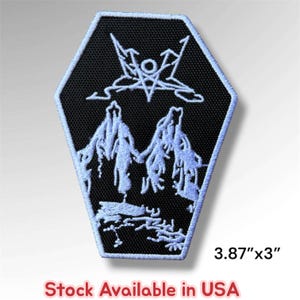 May include: A coffin-shaped embroidered patch with a black background and white thread detailing. The design features a stylized star symbol above two mountain peaks. The patch measures 3.87 inches by 3 inches as indicated by the text.