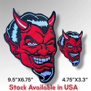 May include: Two embroidered patches featuring a red devil face with black hair, horns, and a wide grin. The larger patch measures 9.5 inches by 6.75 inches, and the smaller patch measures 4.75 inches by 3.3 inches. The text reads Stock Available in USA.