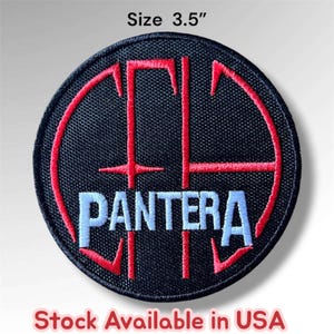 May include: A circular embroidered patch with a black background featuring a red stylized logo and the word PANTERA in light blue lettering. The patch includes the text Size 3.5 inches at the top and Stock Available in USA at the bottom.