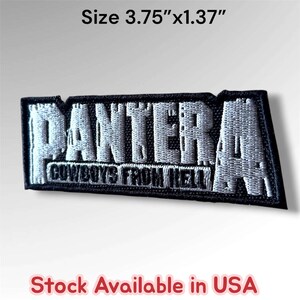 May include: A rectangular embroidered patch featuring the word PANTERA in large, distressed white lettering above the text COWBOYS FROM HELL in smaller white font, all on a black background. The patch measures 3.75 inches by 1.37 inches.