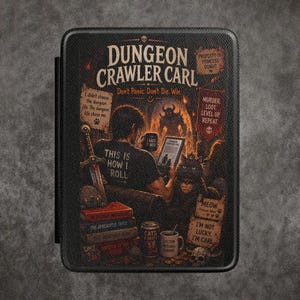 May include: A black rectangular e-reader cover featuring a Dungeon Crawler Carl graphic. The design shows a person in a shirt reading 'THIS IS HOW I ROLL' next to a cat, a sword, books, and mugs. Text includes 'Don't Panic. Don't Die. Win.' and other phrases.