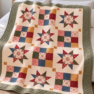 May include: A patchwork quilt featuring alternating blocks of eight-pointed stars and nine-patch squares in red, blue, green, and yellow floral prints, bordered by a textured olive green fabric with a cream-colored background.
