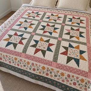 May include: A patchwork quilt featuring a repeating star pattern with floral centers in shades of blue, green, yellow, and red. The quilt is bordered by a pink floral strip and a dark green floral vine pattern on a cream background.