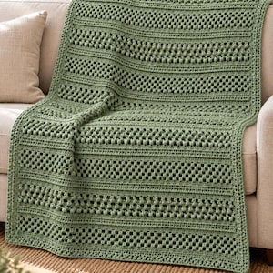 May include: A sage green crochet blanket featuring a repeating pattern of horizontal bands. The design alternates between rows of dense double crochet stitches, open granny square style clusters, and rows of raised bobble stitch textures.
