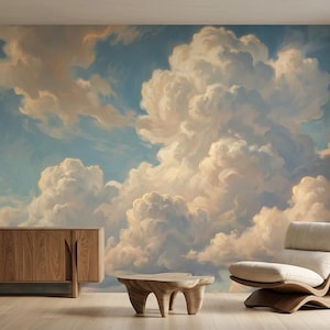May include: A wall mural featuring a painted sky with large, voluminous white and golden-hued clouds against a soft blue background. The scene is displayed behind a wooden sideboard, a low wooden coffee table, and a curved wooden lounge chair.