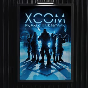 May include: A framed poster featuring the XCOM Enemy Unknown video game title in white text above a blue-toned illustration of five armed soldiers standing in a formation. The scene is illuminated by a bright blue light source from behind.