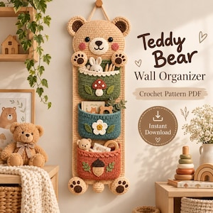 May include: A beige crochet wall organiser shaped like a teddy bear with three hanging pockets in green, blue, and orange. The pockets feature appliqués of a mushroom, a white flower, and an acorn. Text reads Teddy Bear Wall Organiser.