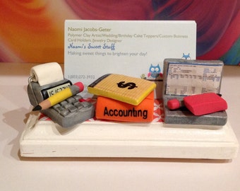 Polymer clay business card designed for an Accountant