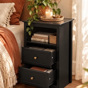 May include: A black wooden nightstand featuring an open top shelf and two pull-out drawers. Each drawer is equipped with a small, round, metallic gold knob. The nightstand has a rectangular frame with clean lines and a smooth, matte black finish.