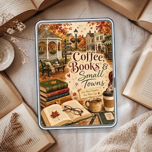 May include: A digital tablet displaying an illustration of a town square with autumn foliage, a gazebo, and a bench. The text reads Coffee, Books & Small Towns, One More Chapter, One More Cup. Below are stacked books, an open book with glasses, a mug, and a notebook.