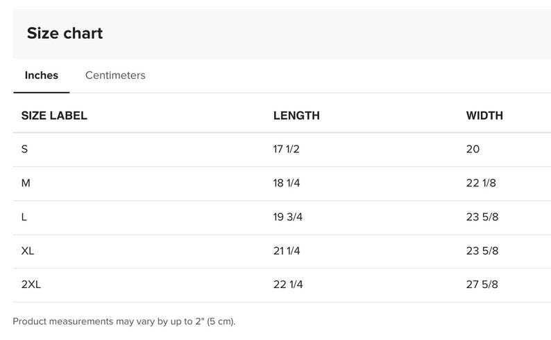 May include: A size chart table with black text on a white background. It lists sizes S, M, L, XL, and 2XL with corresponding length and width measurements in inches. The table includes a note that product measurements may vary by up to 2 inches.