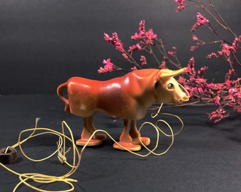 toy cow that moos and walks