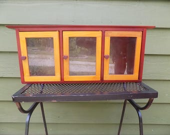 Vintage Red Wooden Ornamental storage cabinet with 3 glass doors