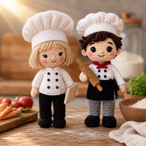 May include: Two crochet dolls dressed as chefs. The left doll has blonde hair, a white chef hat, a white jacket with black buttons, and black trousers, holding a small notepad. The right doll has brown hair, a white chef hat, a white jacket, a black apron, and grey trousers, holding a brown rolling pin.