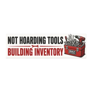 May include: A rectangular sticker featuring the black text NOT HOARDING TOOLS and red text BUILDING INVENTORY, separated by a red wrench icon. To the right, a red toolbox is filled with various metal hand tools and a red power drill.