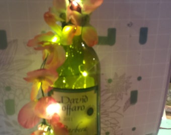 decorated lighted wine bottle