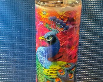 Decorated 20 ounce tumbler with straw