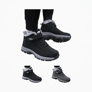 May include: Black ankle boots featuring a gray lug sole, a plush gray interior lining, black laces, and a single hook-and-loop strap across the top. The boots have a rounded toe and a textured tread pattern on the bottom for grip and stability.