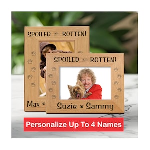 Solid wood frame custom engraved with names and dog paw prints. Title at the top of the picture frame reads Spoiled Rotten!