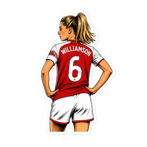 Op de afbeelding: Een stickerillustratie van een voetbalspeler van achteren gezien, gekleed in een rood-wit shirt met de naam WILLIAMSON en het nummer 6 op de rug. De speler heeft blond haar in een paardenstaart en draagt een witte voetbalshort.