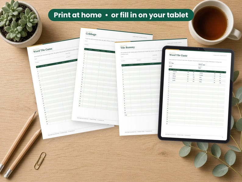 Game Night Score Sheets printed on a desk and shown on a tablet, printable and fillable