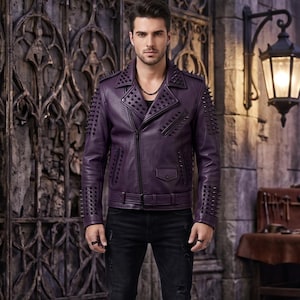 May include: A deep purple leather jacket featuring a notched lapel, an asymmetrical front zipper, a buckled waist belt, and numerous black spikes covering the shoulders, sleeves, and lapels, paired with distressed black denim jeans.