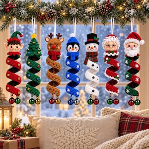 May include: Seven hanging crochet Christmas ornaments featuring an elf, a tree, a reindeer, a penguin, a snowman, Mrs. Claus, and Santa Claus. Each character is attached to a long, spiraling, colorful crochet tail ending with two small metal bells.