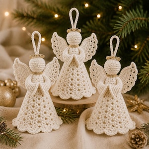 May include: Three off-white crocheted angel ornaments with gold-colored beaded halos and neck accents. Each angel features a textured, flared skirt with a scalloped hem, detailed wings, and a loop at the top for hanging, arranged in a group.