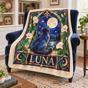 May include: A rectangular throw blanket featuring a stained glass style print of a black cat sitting on a ledge looking at a full moon. The design includes white morning glory flowers, a night sky, and the name LUNA in gold capital letters.