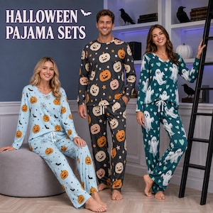 May include: Three sets of long-sleeve pajama sets with Halloween themes. One set is light blue with orange pumpkins, black bats, and spiderwebs. Another is dark gray with orange pumpkins and stars. The third is dark green with white ghosts and hearts.