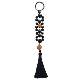 Pingente de bolsa exclusivo com pedras de vidro e cristal e tassel preto.